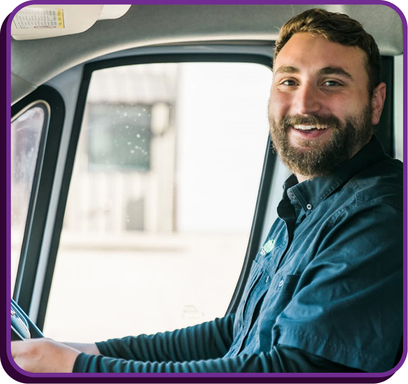 employee in front seat of work van